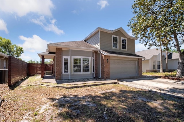 10724 Harkwood Blvd, Orlando, FL 32817 - traditional-style house featuring concrete driveway, an attached garage, brick siding, central AC unit, and fence