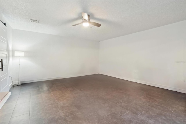 10724 Harkwood Blvd, Orlando, FL 32817 - unfurnished room featuring visible vents, baseboards, a textured ceiling, and ceiling fan