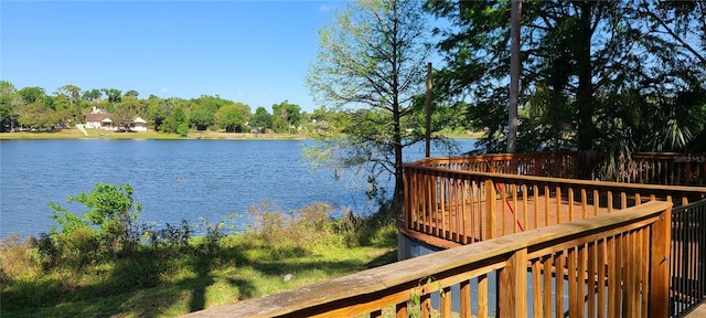 wooden deck featuring a water view