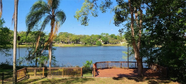property view of water featuring fence
