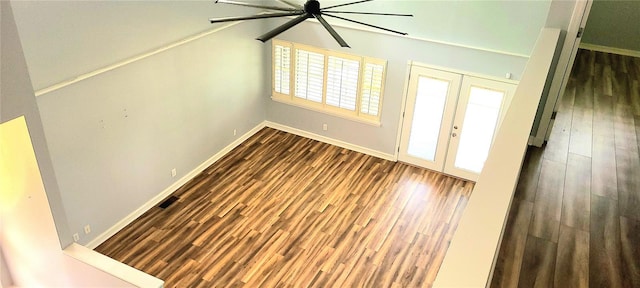 interior space featuring french doors, ceiling fan, baseboards, and dark wood-style floors