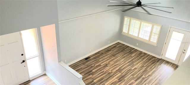 entrance foyer featuring baseboards, a ceiling fan, and wood finished floors