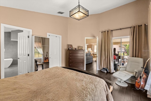 618 Via Milano, Apopka, FL 32712 - bedroom with multiple windows, hardwood / wood-style floors, visible vents, and a high ceiling