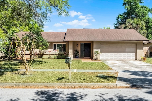 607 Wavecrest Dr, Orlando, FL 32807 - single story home featuring a front lawn, driveway, stucco siding, and an attached garage