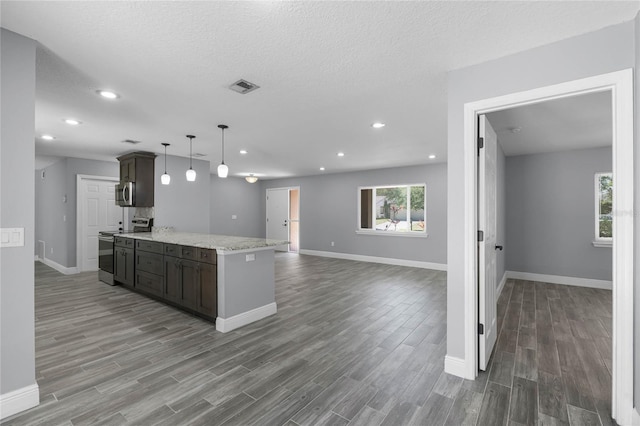 607 Wavecrest Dr, Orlando, FL 32807 - kitchen featuring plenty of natural light, visible vents, stainless steel appliances, and wood finished floors