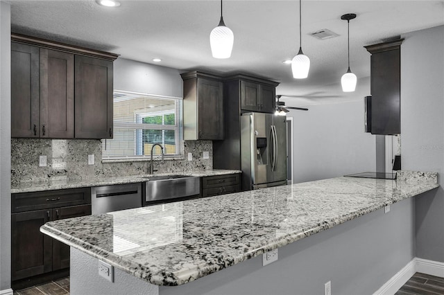 607 Wavecrest Dr, Orlando, FL 32807 - kitchen featuring decorative backsplash, dark wood-style flooring, visible vents, appliances with stainless steel finishes, and a sink