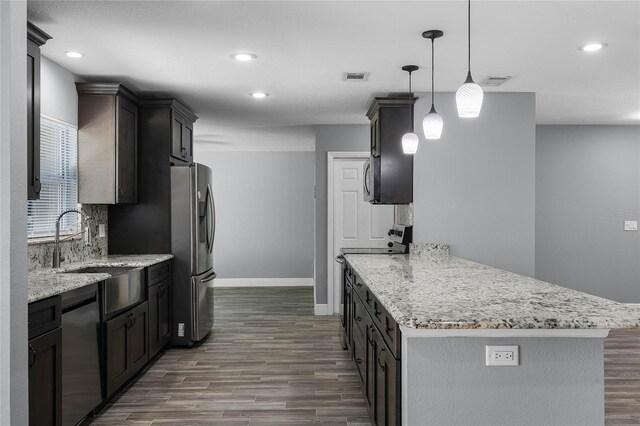 607 Wavecrest Dr, Orlando, FL 32807 - kitchen featuring dark wood-style flooring, stainless steel fridge, a sink, dishwashing machine, and electric range