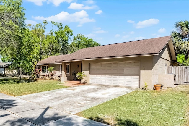 607 Wavecrest Dr, Orlando, FL 32807 - ranch-style home featuring a front lawn, fence, driveway, and a garage