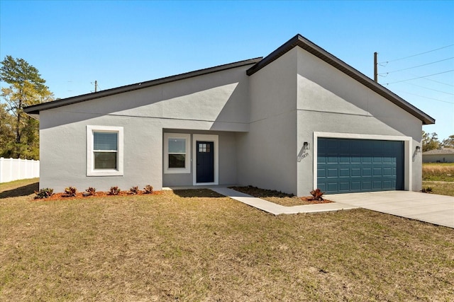 view of front of house featuring a front lawn, stucco siding, an attached garage, and concrete driveway
