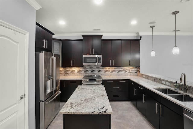 kitchen featuring ornamental molding, a center island, backsplash, appliances with stainless steel finishes, and a sink