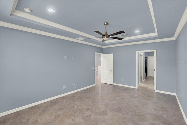 unfurnished bedroom featuring a raised ceiling, baseboards, ornamental molding, and visible vents