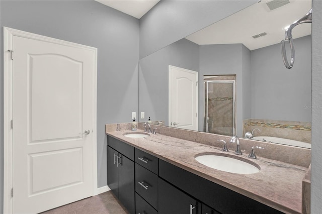 full bathroom with a shower stall, a sink, and visible vents