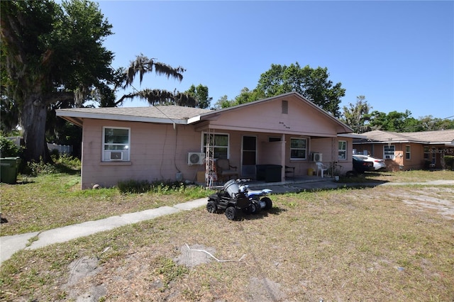2220 Ave F NW, Winter Haven, FL 33880 - view of front of property with a patio area and a front lawn