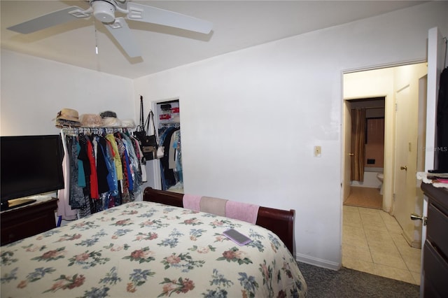 2220 Ave F NW, Winter Haven, FL 33880 - carpeted bedroom with a closet, tile patterned floors, and ceiling fan