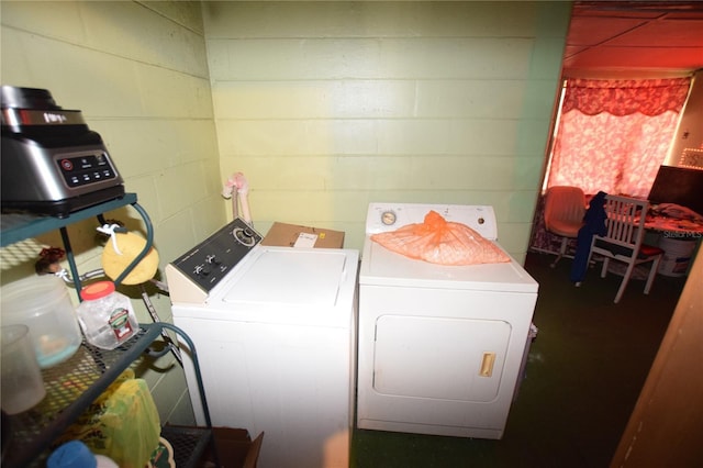 2220 Ave F NW, Winter Haven, FL 33880 - clothes washing area with washer and dryer, laundry area, and concrete block wall