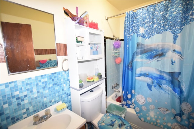 2220 Ave F NW, Winter Haven, FL 33880 - bathroom with shower / bath combo with shower curtain, vanity, tile walls, and toilet