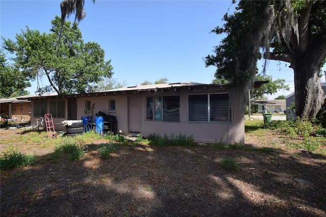 2220 Ave F NW, Winter Haven, FL 33880 - rear view of house with concrete block siding