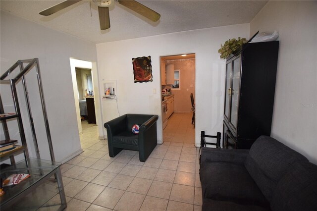2220 Ave F NW, Winter Haven, FL 33880 - living area with light tile patterned flooring and a ceiling fan