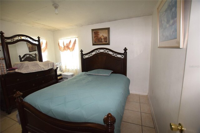 2220 Ave F NW, Winter Haven, FL 33880 - bedroom with tile patterned floors and baseboards