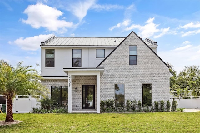 2408 Lafayette Ave, Winter Park, FL 32789 - modern farmhouse featuring brick siding, fence, a front lawn, and a gate