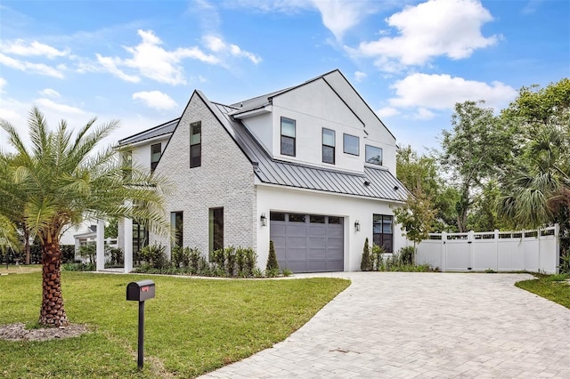 2408 Lafayette Ave, Winter Park, FL 32789 - modern farmhouse featuring metal roof, decorative driveway, a garage, a front yard, and a standing seam roof