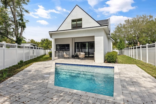 2408 Lafayette Ave, Winter Park, FL 32789 - back of property with a patio, a fenced in pool, a fenced backyard, and stucco siding