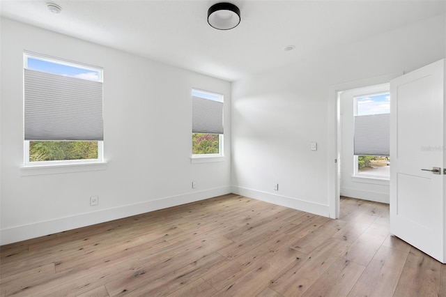 2408 Lafayette Ave, Winter Park, FL 32789 - spare room featuring baseboards, plenty of natural light, and light wood finished floors