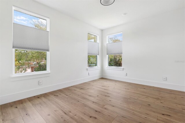2408 Lafayette Ave, Winter Park, FL 32789 - unfurnished room with baseboards and hardwood / wood-style flooring