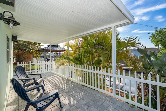 view of patio / terrace with a gazebo and fence