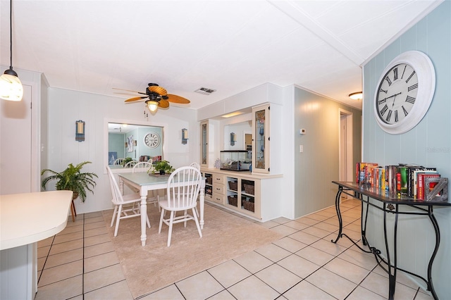 dining space with visible vents, a ceiling fan, and light tile patterned floors