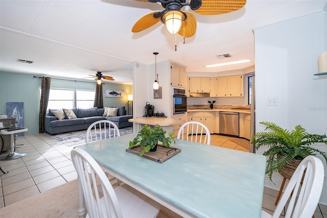 dining space featuring ceiling fan, light tile patterned flooring, and visible vents