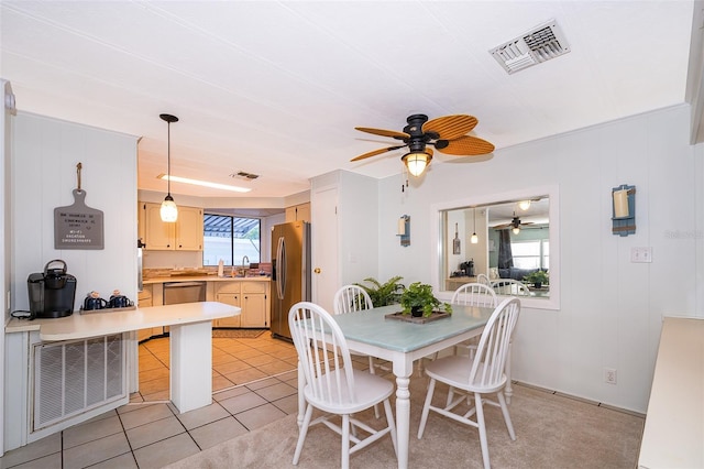 dining room with visible vents, ceiling fan, and light tile patterned floors