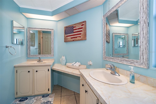 bathroom featuring two vanities, tile patterned flooring, and a sink