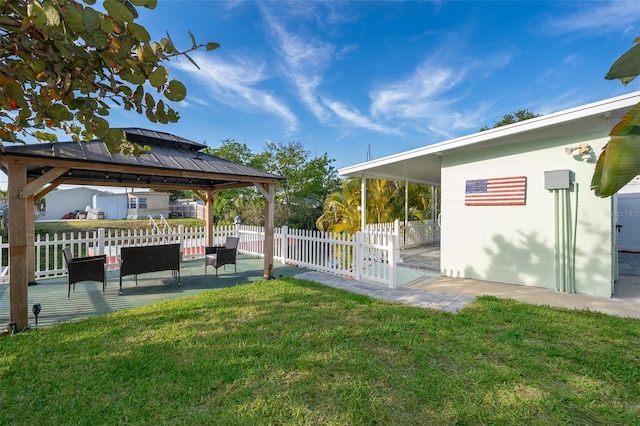 view of yard with fence, a patio area, and a gazebo
