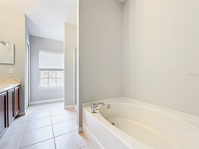 10852 Spider Lily Dr Unit S, Orlando, FL 32832 - bathroom with vanity, a bath, baseboards, tile patterned floors, and a shower with shower door