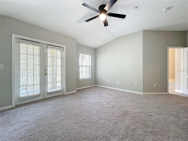 10852 Spider Lily Dr Unit S, Orlando, FL 32832 - spare room with vaulted ceiling, ceiling fan, baseboards, carpet floors, and french doors