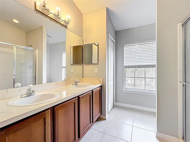 10852 Spider Lily Dr Unit S, Orlando, FL 32832 - full bathroom featuring a shower stall, double vanity, tile patterned floors, and baseboards