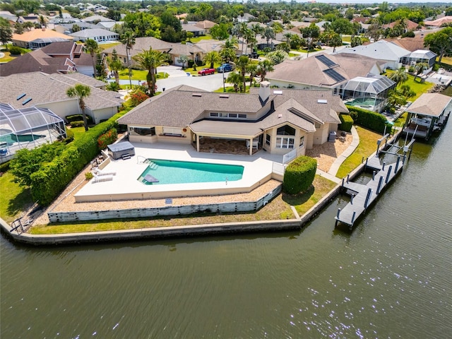 aerial view featuring a water view and a residential view