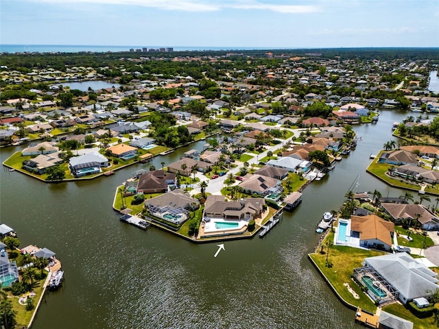 drone / aerial view with a residential view and a water view