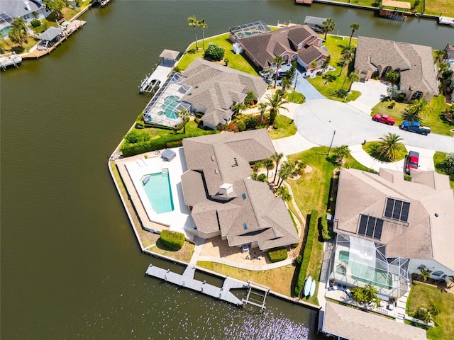 bird's eye view featuring a water view and a residential view