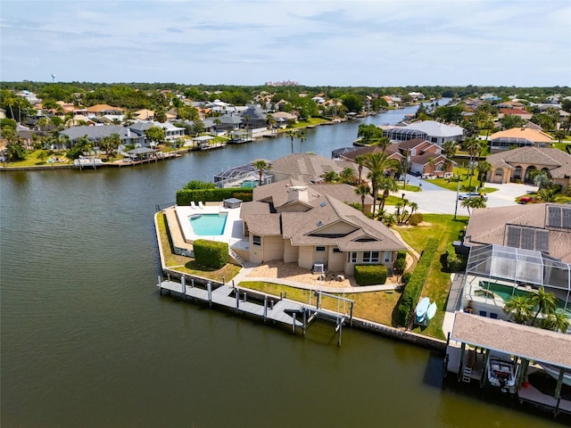 aerial view with a residential view and a water view