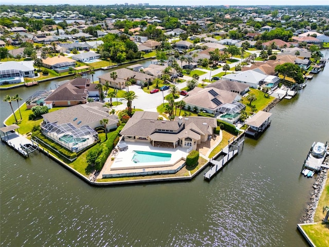 birds eye view of property featuring a water view and a residential view
