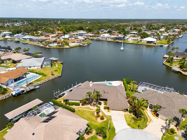 bird's eye view featuring a water view and a residential view