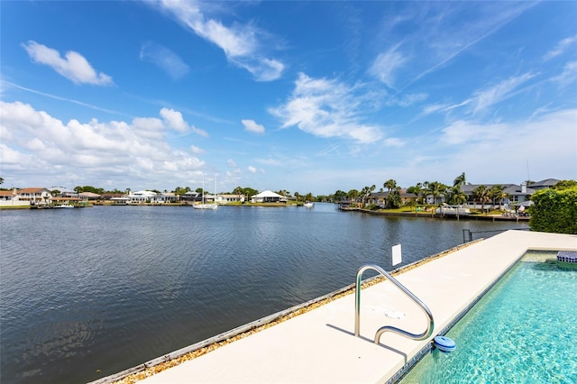 pool featuring a water view and a residential view
