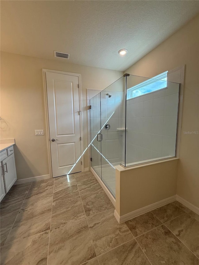 8243 Fenton St, Orlando, FL 32836 - bathroom featuring a shower stall, baseboards, visible vents, and vanity