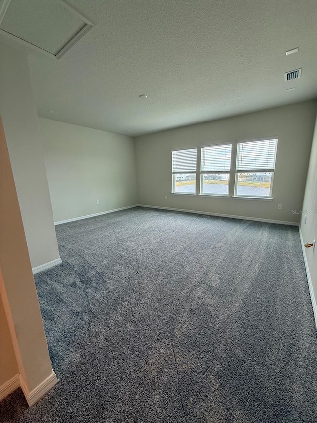 8243 Fenton St, Orlando, FL 32836 - spare room with baseboards, carpet flooring, a textured ceiling, and visible vents
