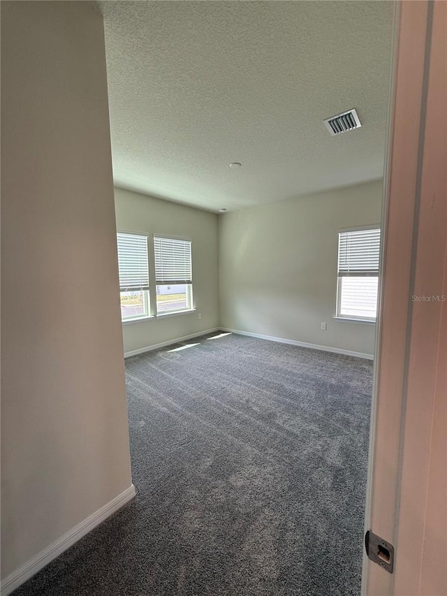 8243 Fenton St, Orlando, FL 32836 - spare room featuring baseboards, carpet floors, and visible vents