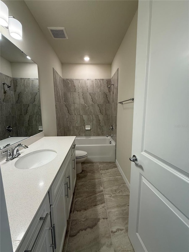 8243 Fenton St, Orlando, FL 32836 - full bathroom with tub / shower combination, visible vents, baseboards, toilet, and vanity