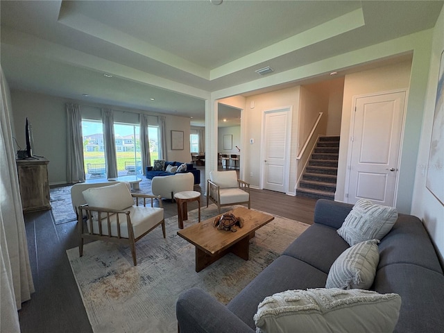8243 Fenton St, Orlando, FL 32836 - living room with wood finished floors, healthy amount of natural light, stairs, recessed lighting, and a tray ceiling