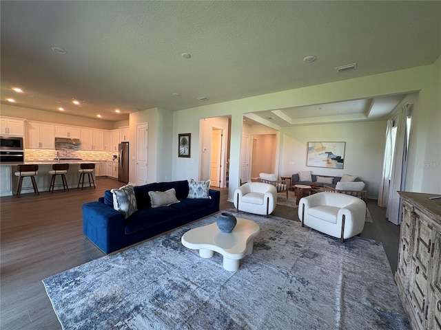 8243 Fenton St, Orlando, FL 32836 - living room with dark wood-type flooring and recessed lighting